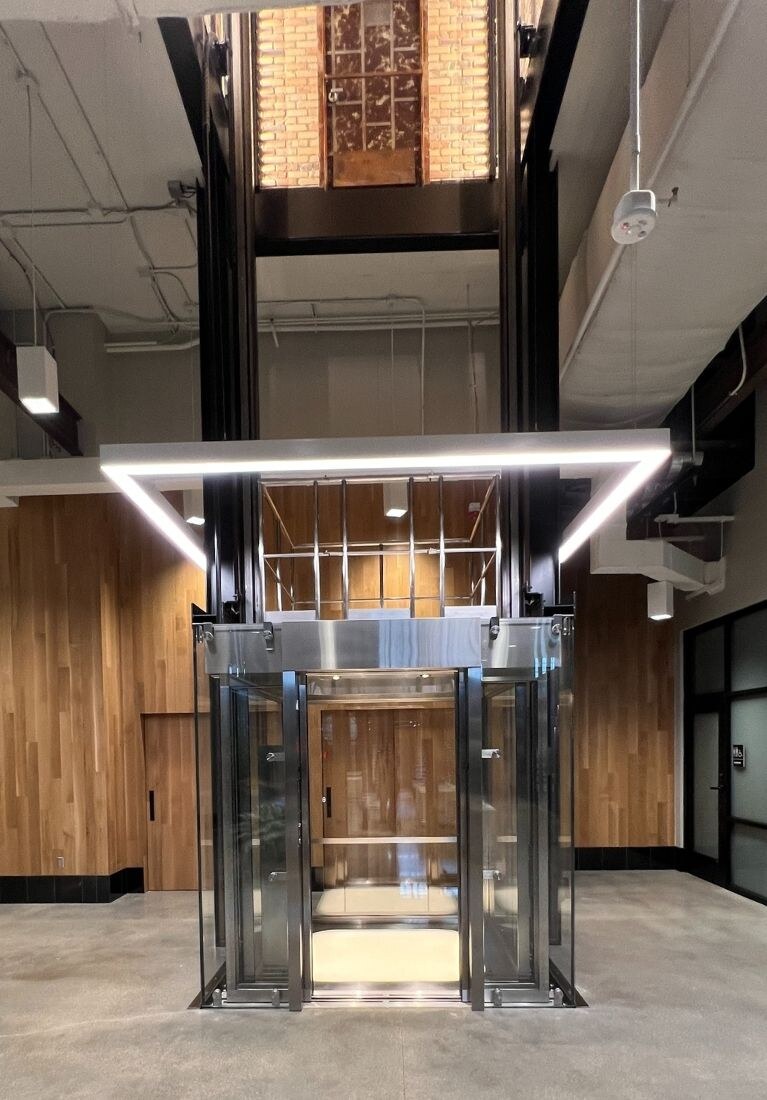 Electric Works Glass Elevator Installation by Liberty Elevator - Lobby Modernization