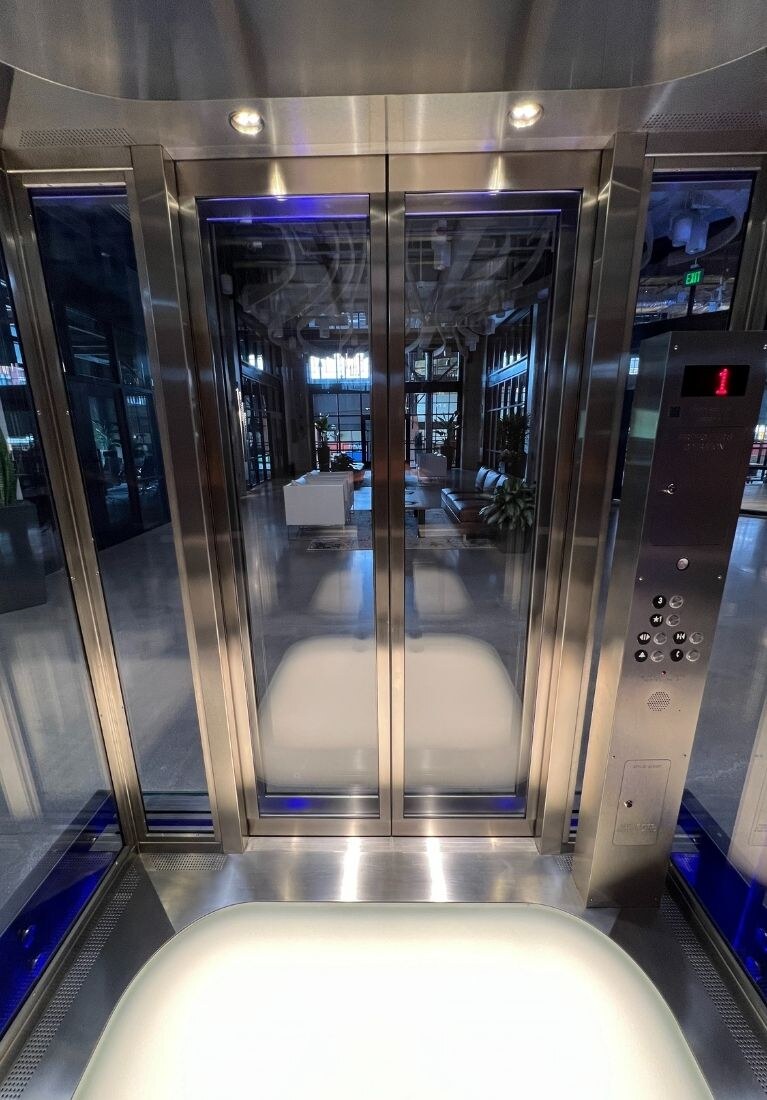 Electric Works Glass Elevator Installation by Liberty Elevator - Light Up Dance Floor