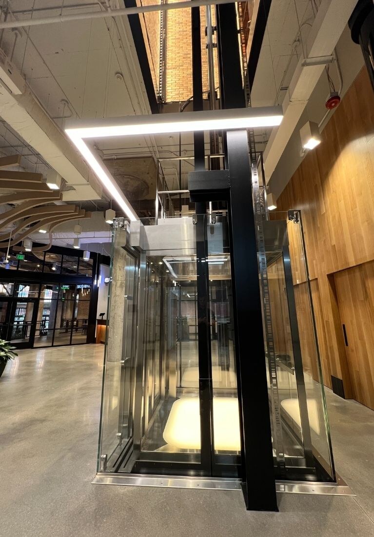 Electric Works Glass Elevator Installation by Liberty Elevator - Shaft Supports