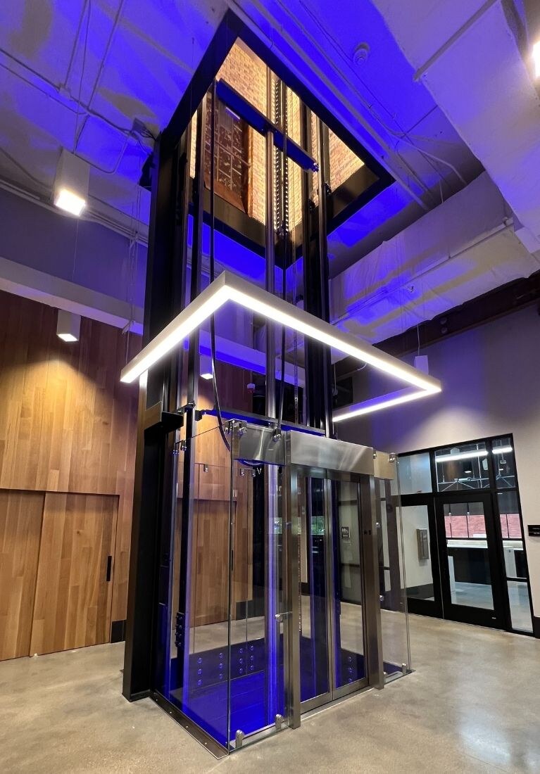 Electric Works Glass Elevator Installation by Liberty Elevator - Blue