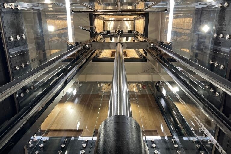 Electric Works Glass Elevator Installation by Liberty Elevator - Elevator Pit