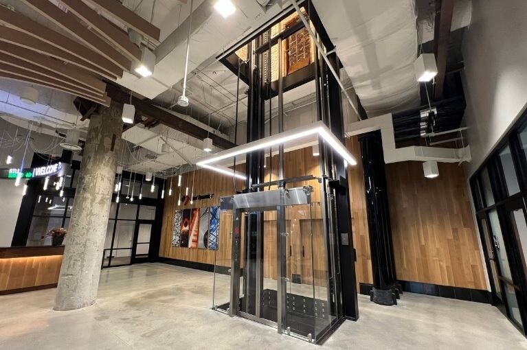 Electric Works Glass Elevator Installation by Liberty Elevator - Steel Dynamics Lobby